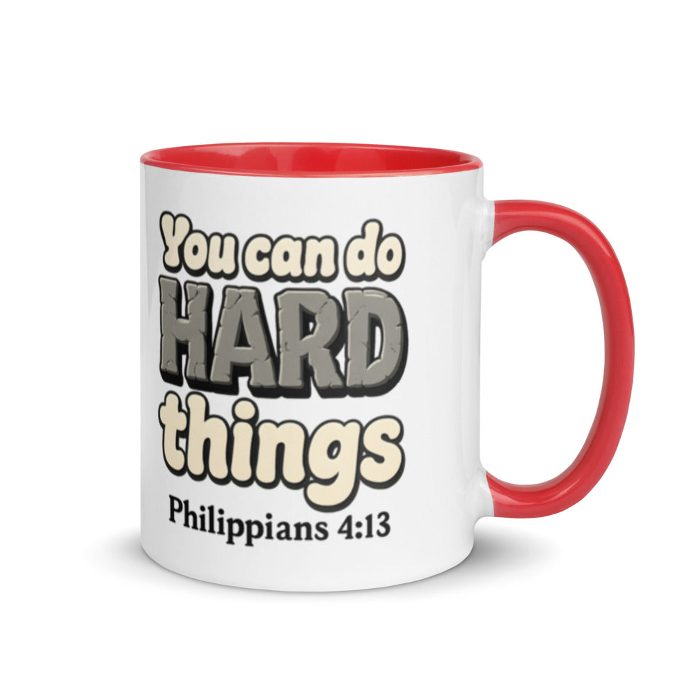 White mug with a red inside and handle printed with “You can do HARD things” in cracked stone letters and Philippians 4:13
