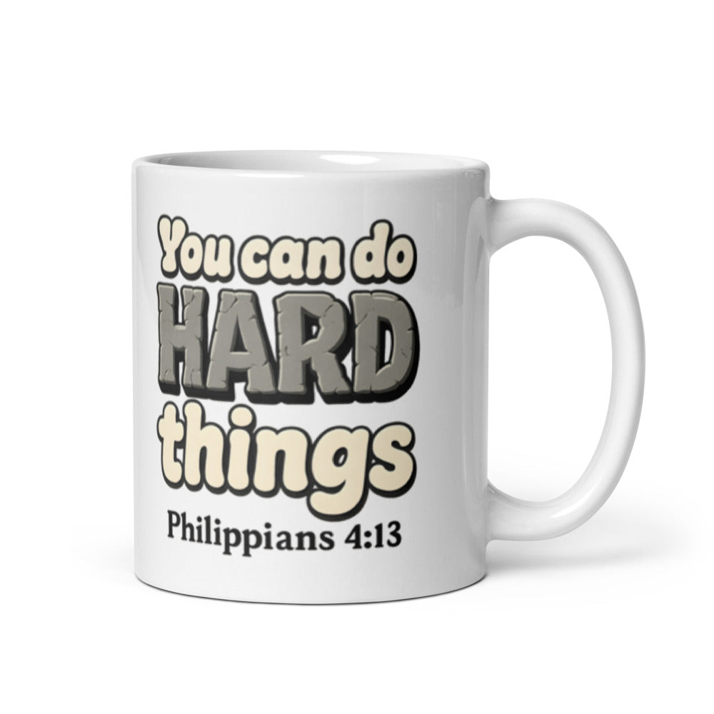11 oz white mug printed with “You can do HARD things” in cracked stone letters and Philippians 4:13