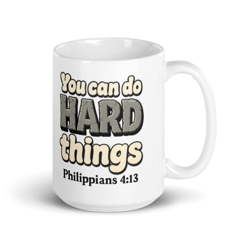 15 oz white mug printed with “You can do HARD things” in cracked stone letters and Philippians 4:13