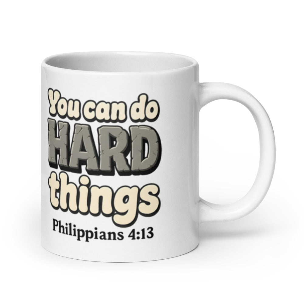 20 oz white mug printed with “You can do HARD things” in cracked stone letters and Philippians 4:13