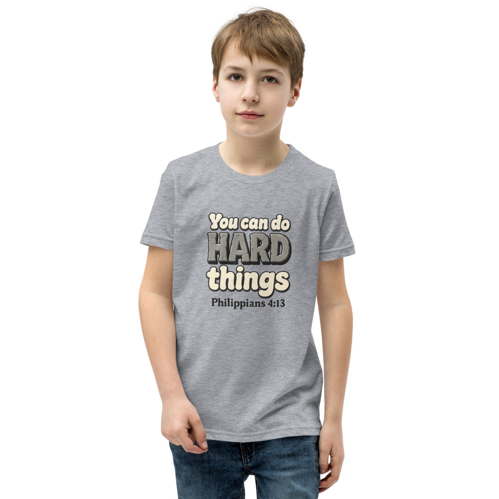 Athletic Heather youth t-shirt printed with “You can do HARD things” in cracked stone letters and Philippians 4:13